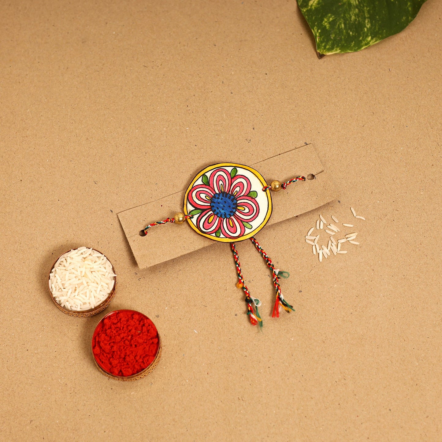 Handpainted Tholu Bommalata Leather Rakhi