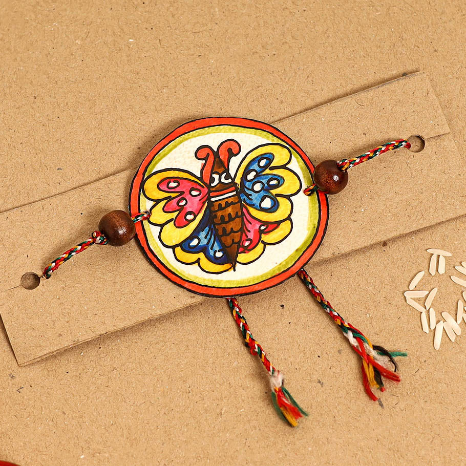 Handpainted Tholu Bommalata Leather Rakhi