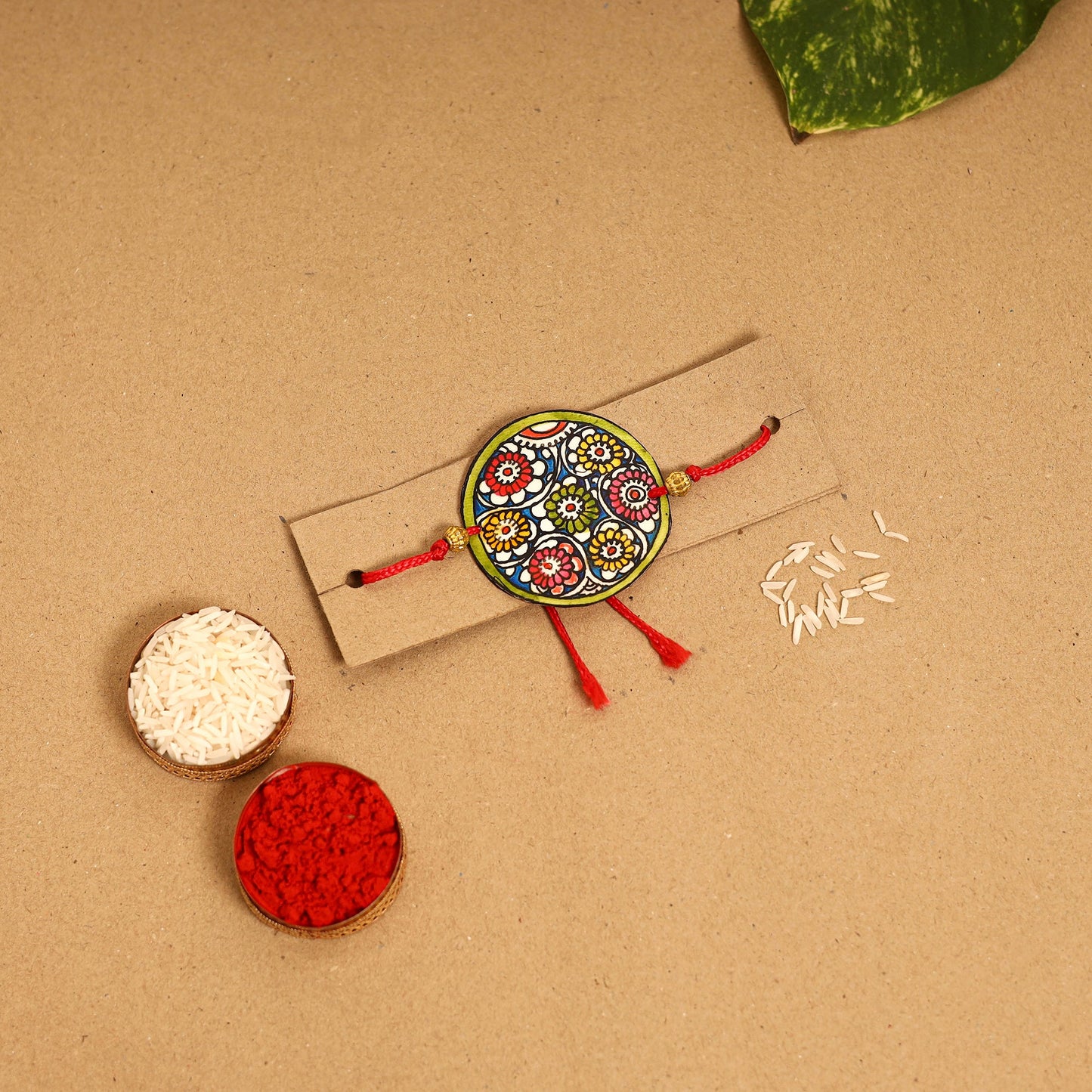 Handpainted Tholu Bommalata Leather Rakhi