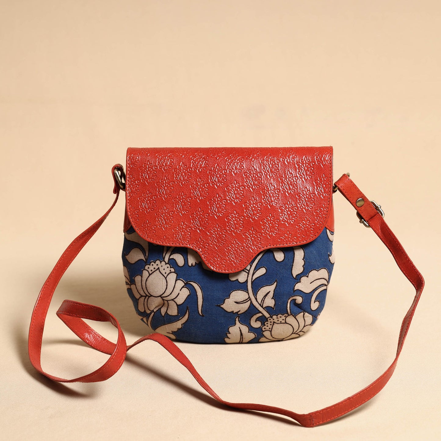 Handcrafted Kalamkari Printed Sling Bag with Embossed Leather Flap