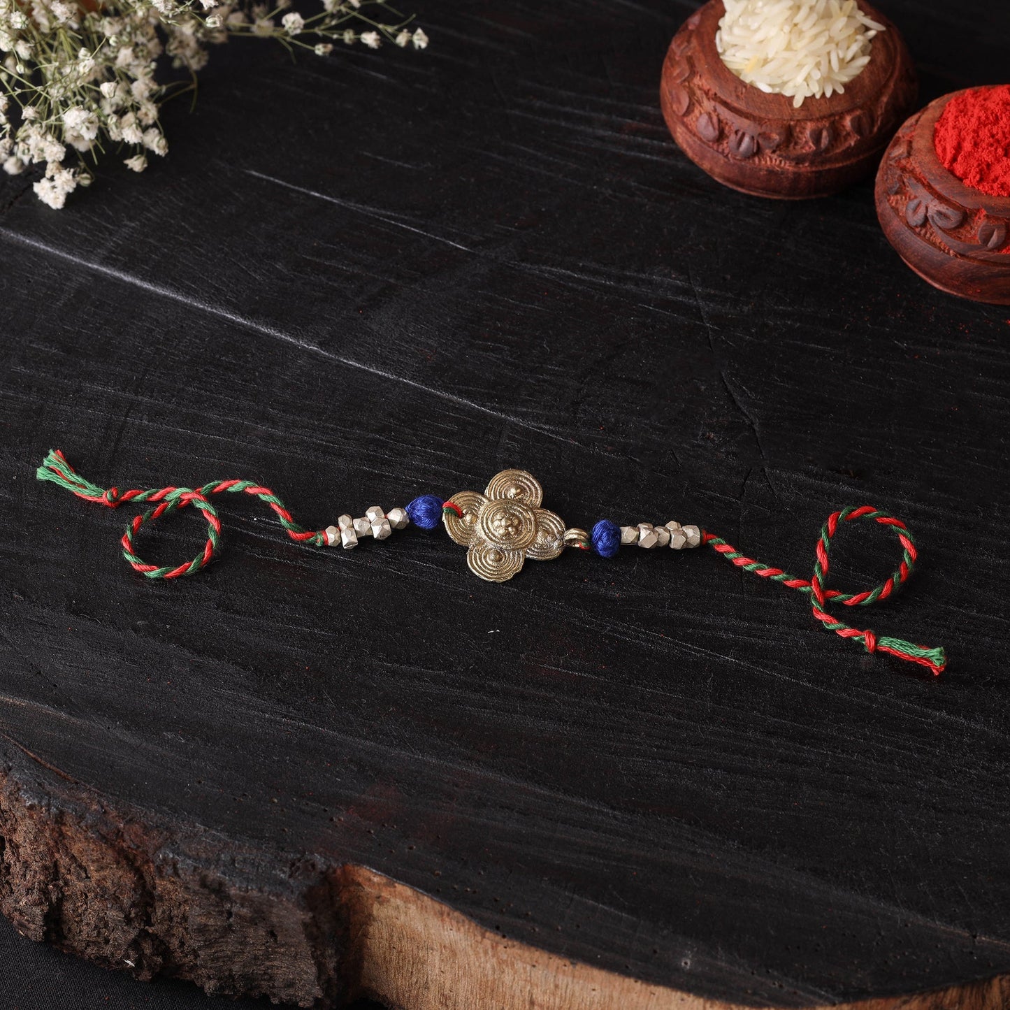 Handcrafted tribal dokra brass thread rakhi 04