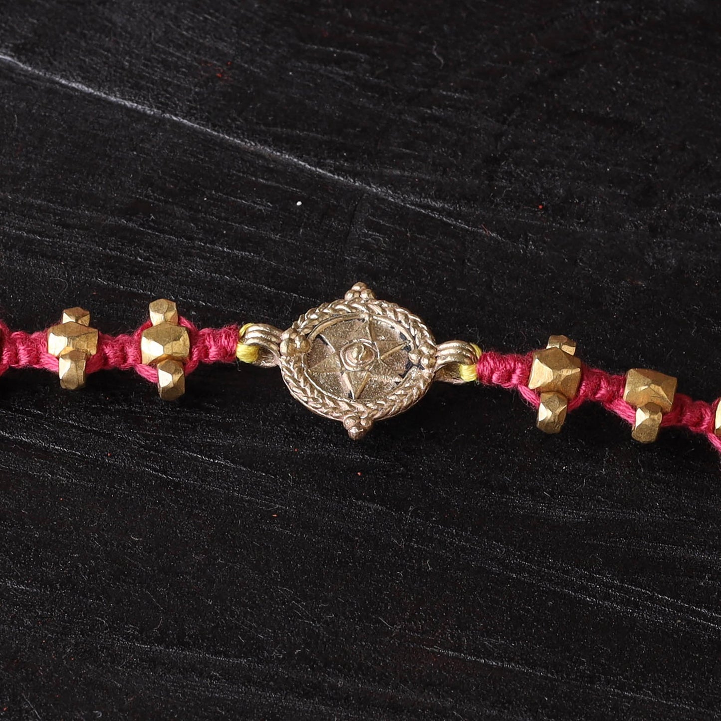 Handcrafted tribal dokra brass thread rakhi 08