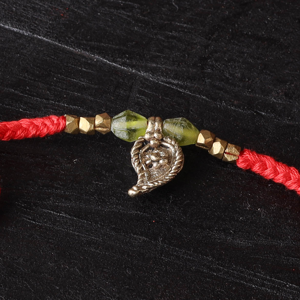 Handcrafted tribal dokra brass thread rakhi 23