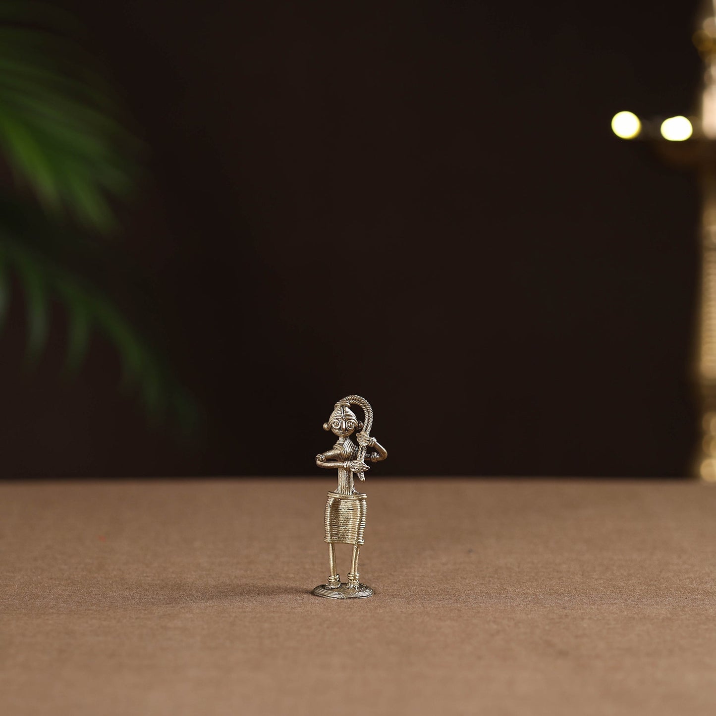 Standing lady with braising her hair tribal odisha dokra