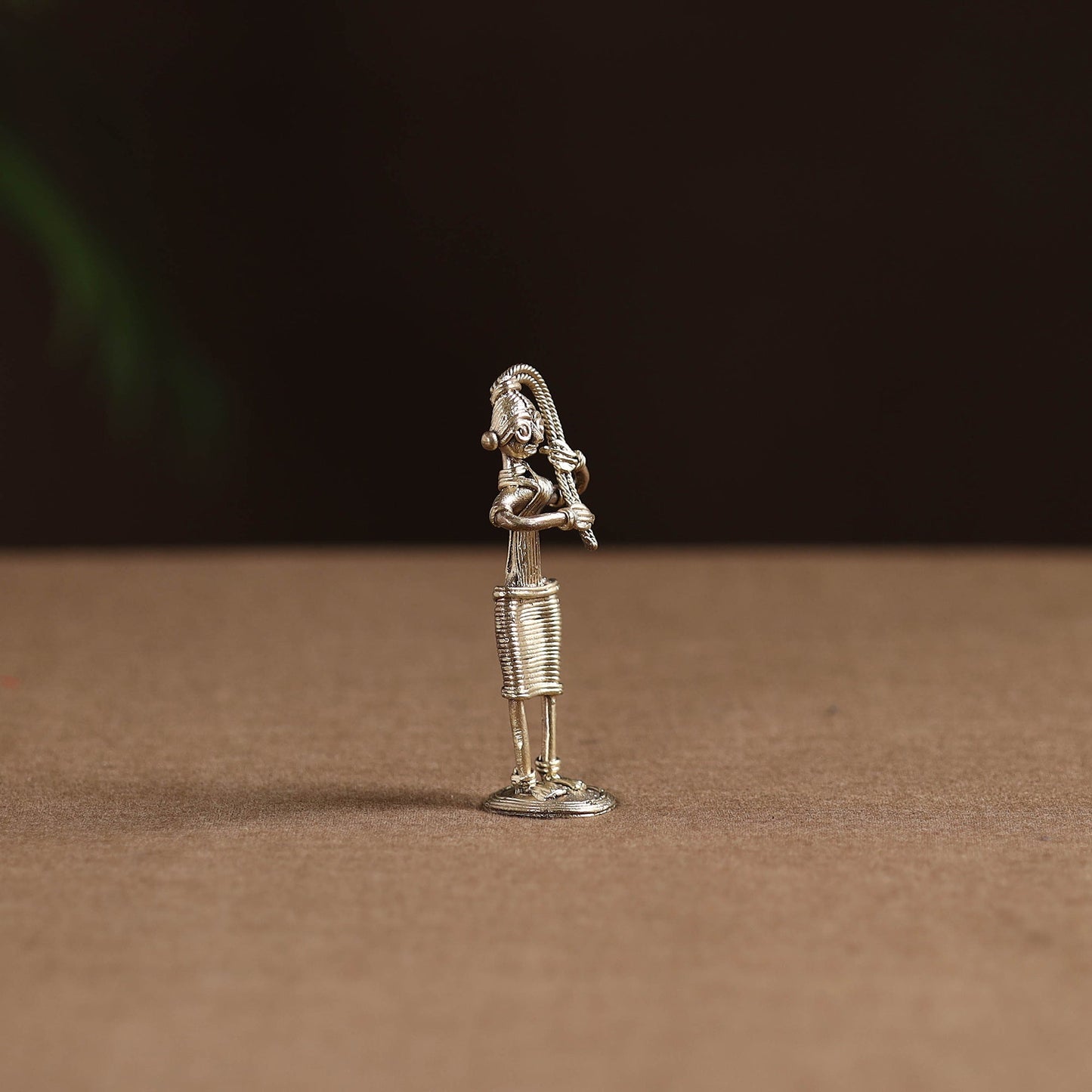 Standing lady with braising her hair tribal odisha dokra