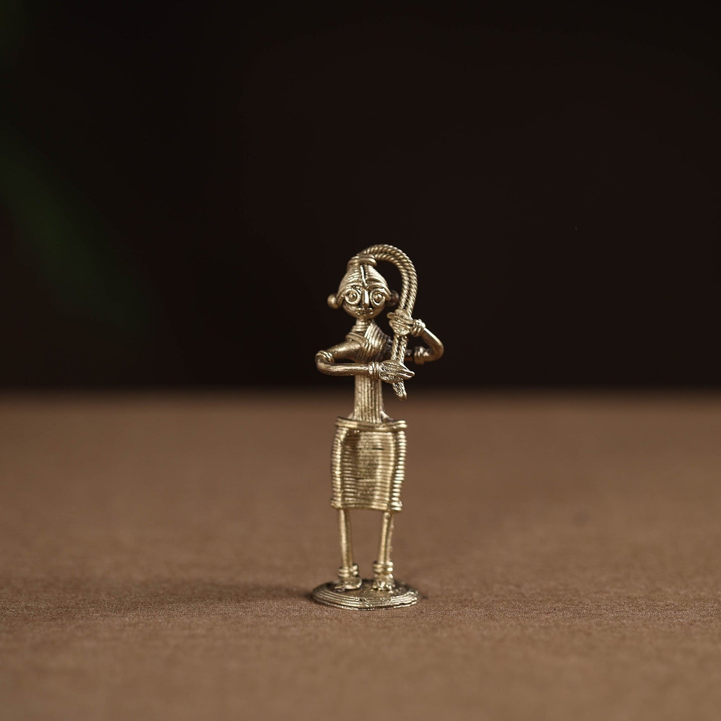 Standing lady with braising her hair tribal odisha dokra