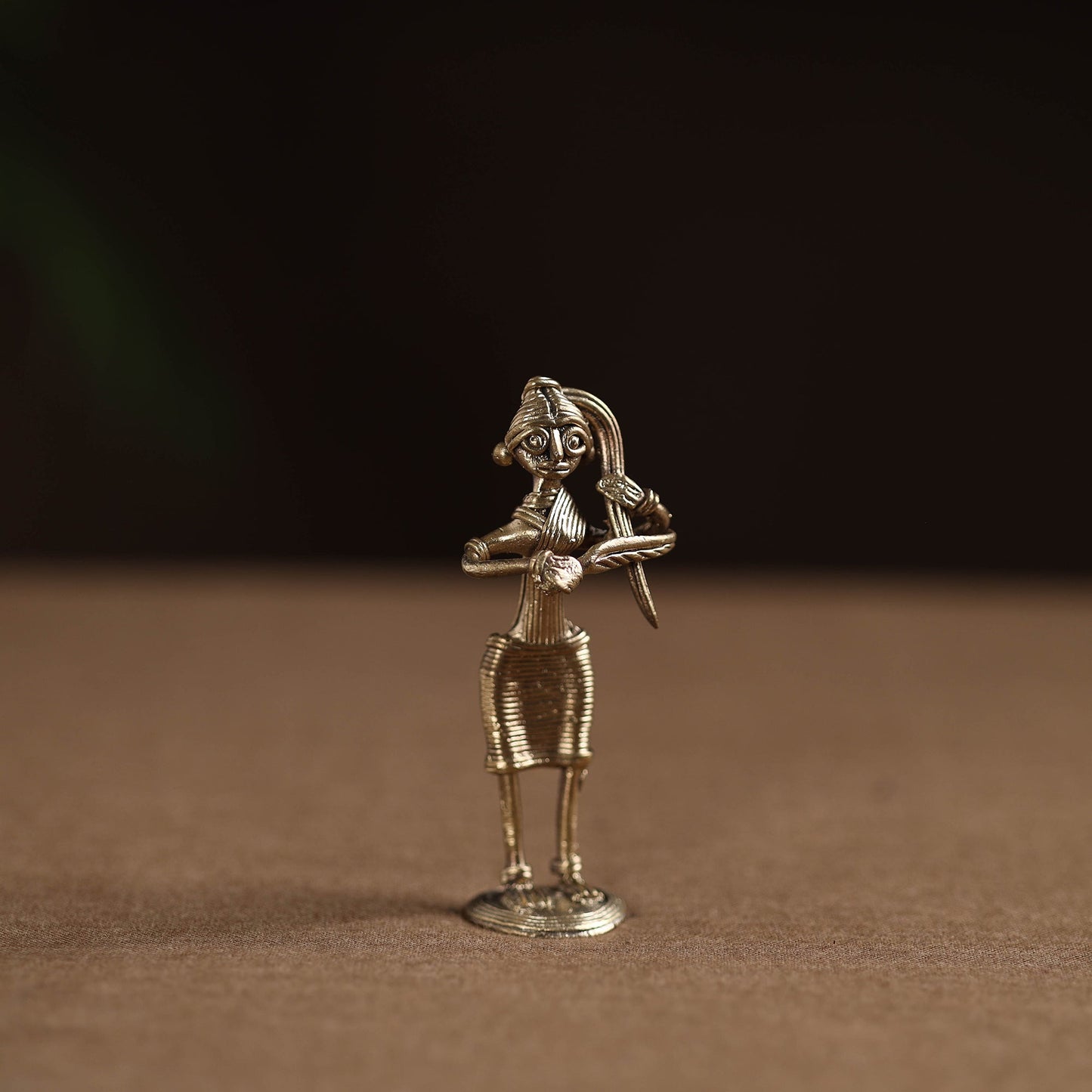 Standing lady with combing hair tribal odisha dokra art