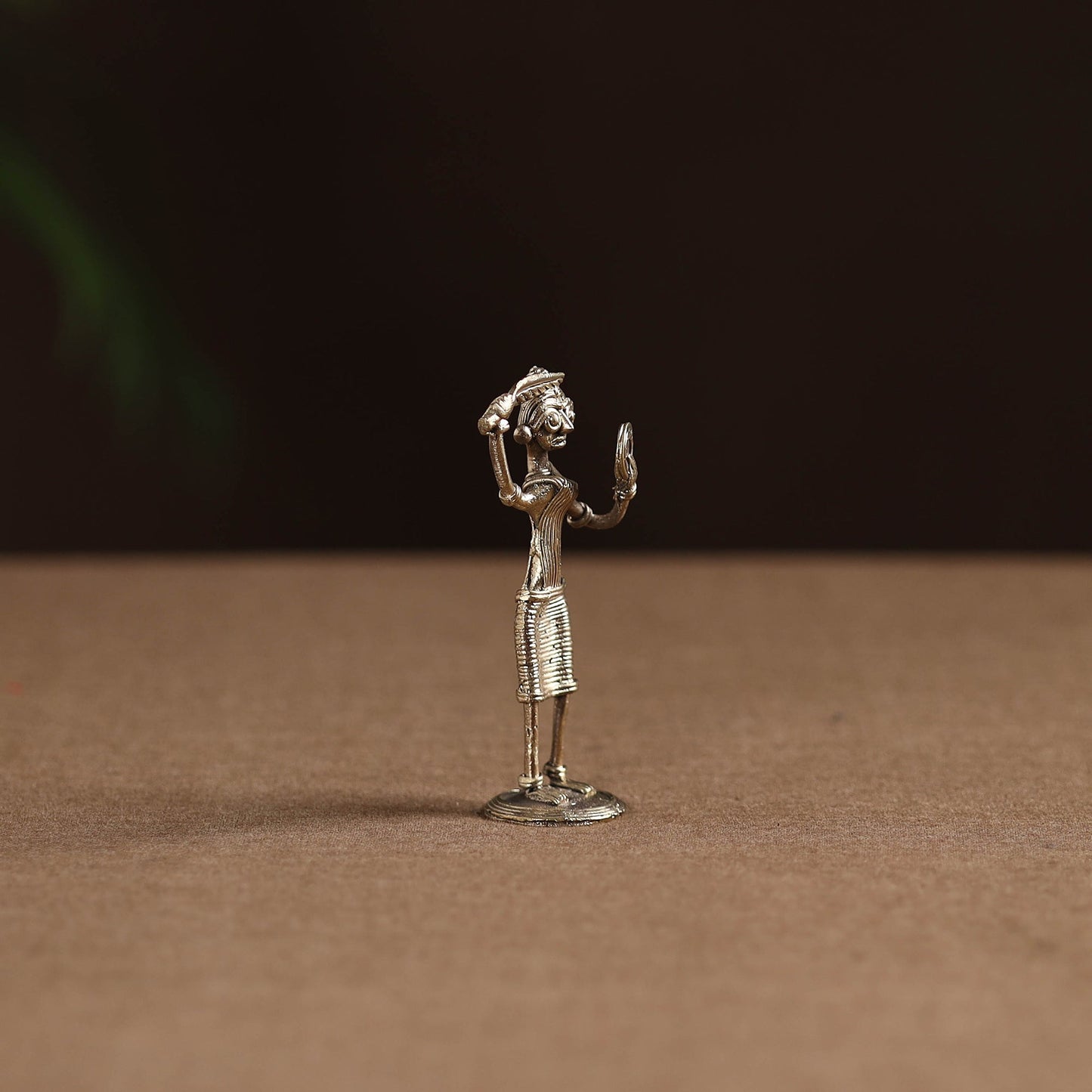 Standing lady with combing hair tribal odisha dokra art