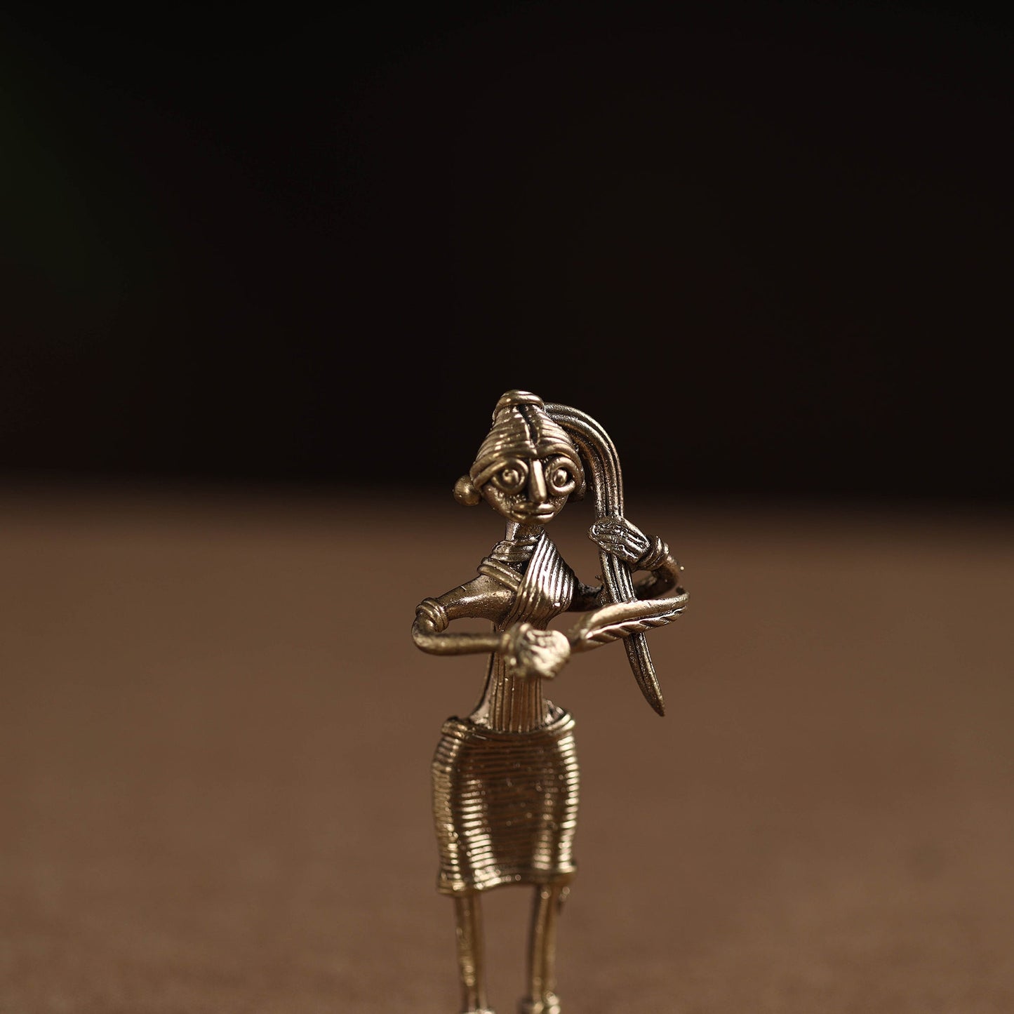 Standing lady with combing hair tribal odisha dokra art