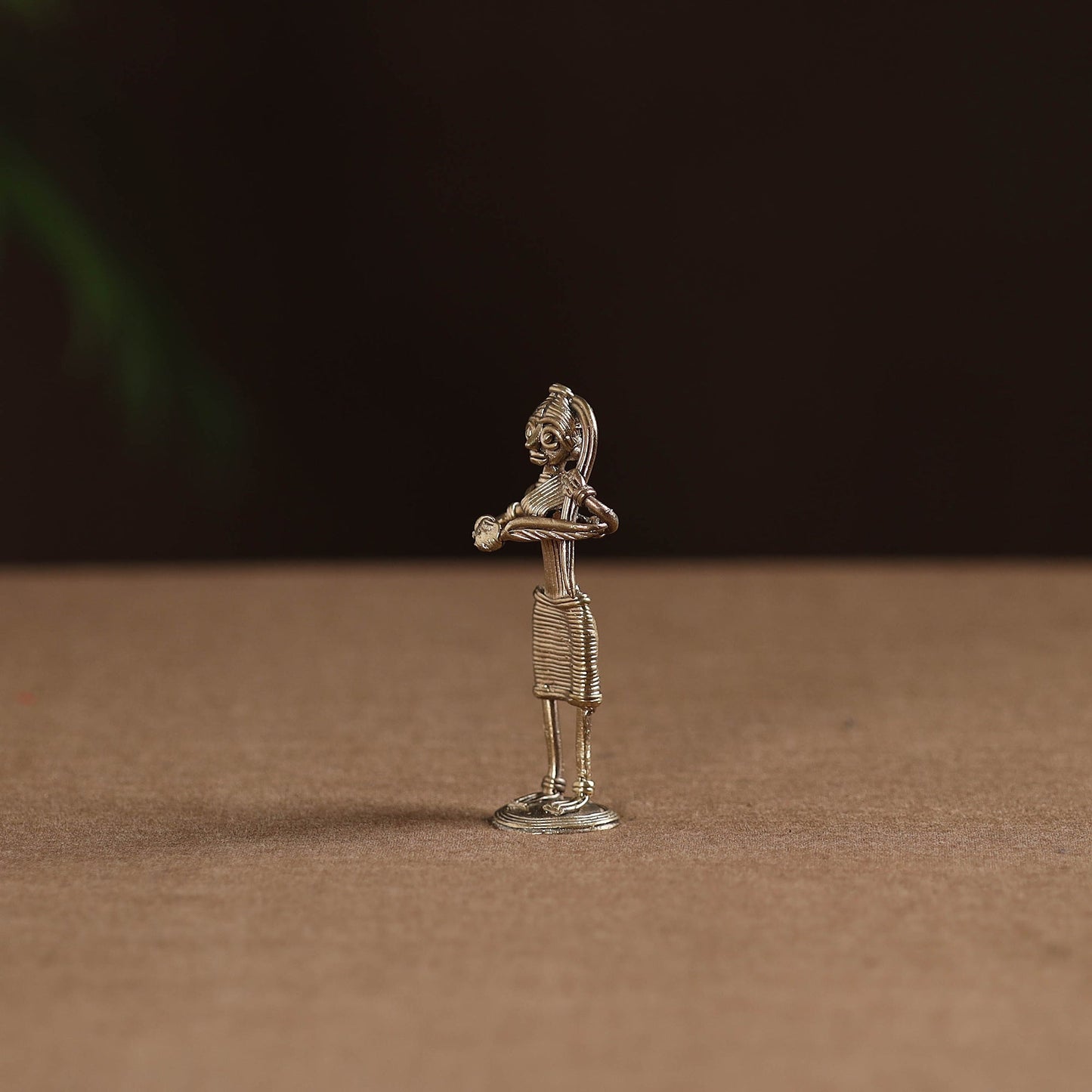 Standing lady with combing hair tribal odisha dokra art