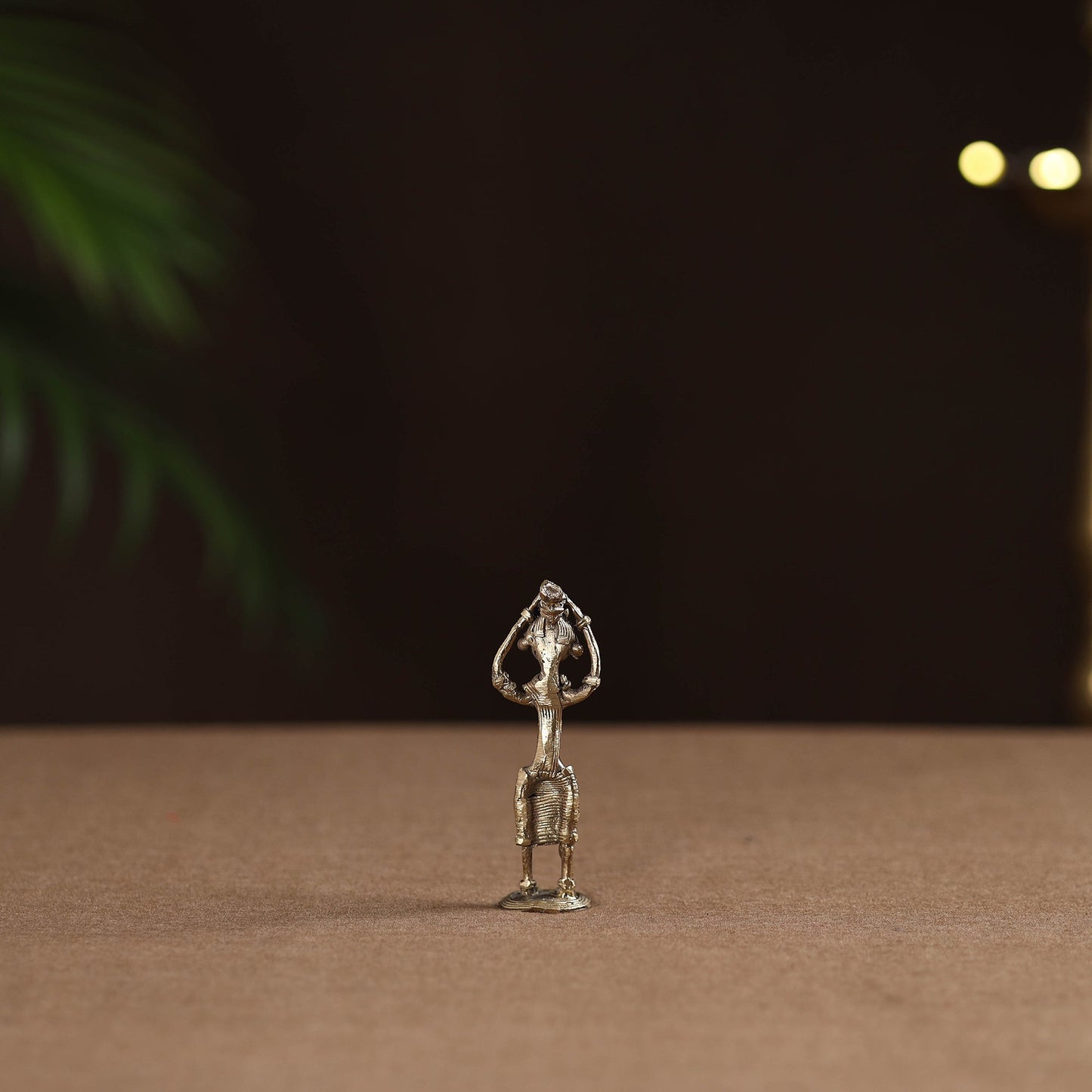 Standing lady with holding wooden gate tribal odisha dokra