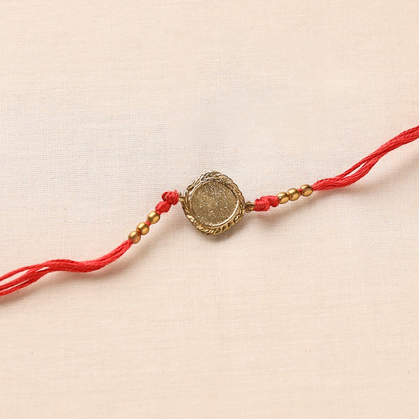 Tribal Dokra Craft Brass Rakhi by Miharu