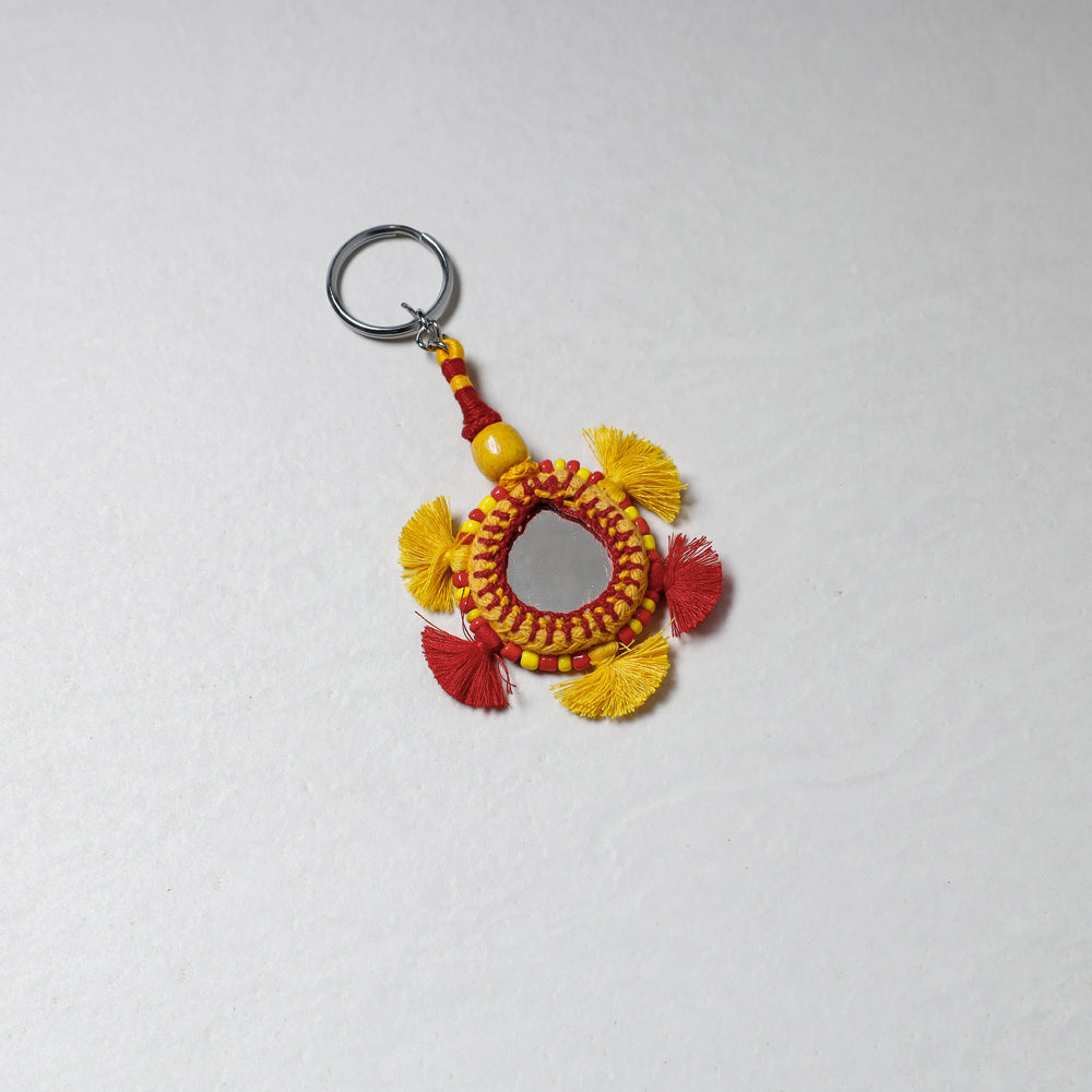 Yellow Handmade Mirror & Threadwork Keychain by Kailash Patwa