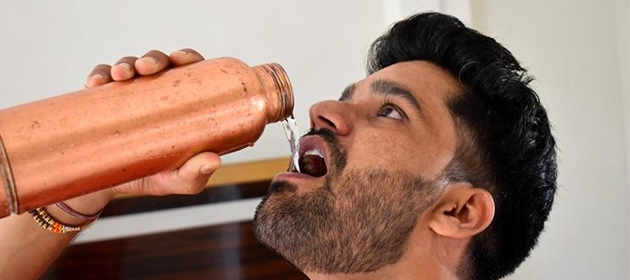  Drinking Water from Copper Bottle