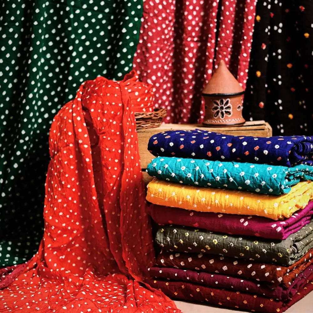Bandhani Tye-Dye Fabrics. Featuring a majestic bandhani pattern, this fabric is hand-tied and dyed using the traditional technique practiced by the artisans of Kutch. 