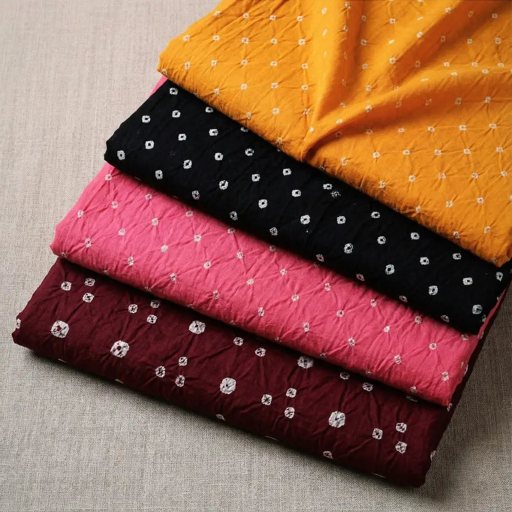Bandhani Tye-Dye Fabrics. Featuring a majestic bandhani pattern, this fabric is hand-tied and dyed using the traditional technique practiced by the artisans of Kutch. 