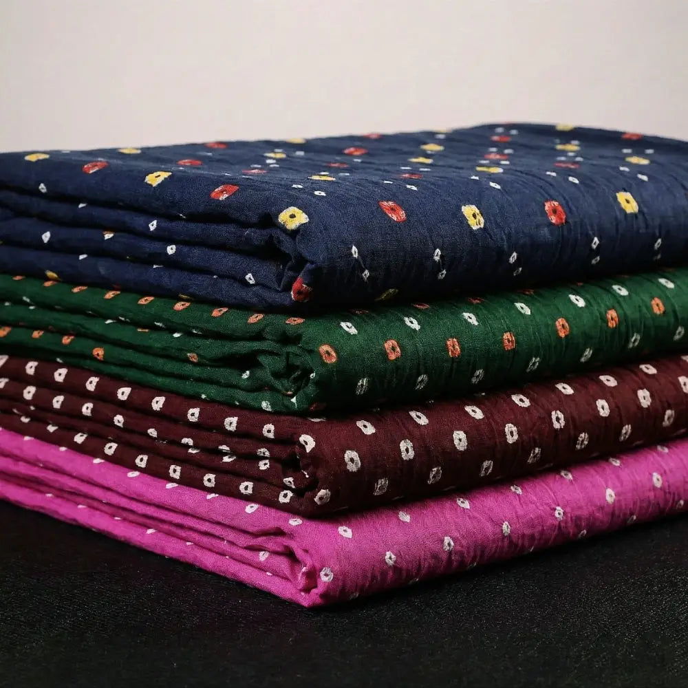 Bandhani Tye-Dye Fabrics. Featuring a majestic bandhani pattern, this fabric is hand-tied and dyed using the traditional technique practiced by the artisans of Kutch. 