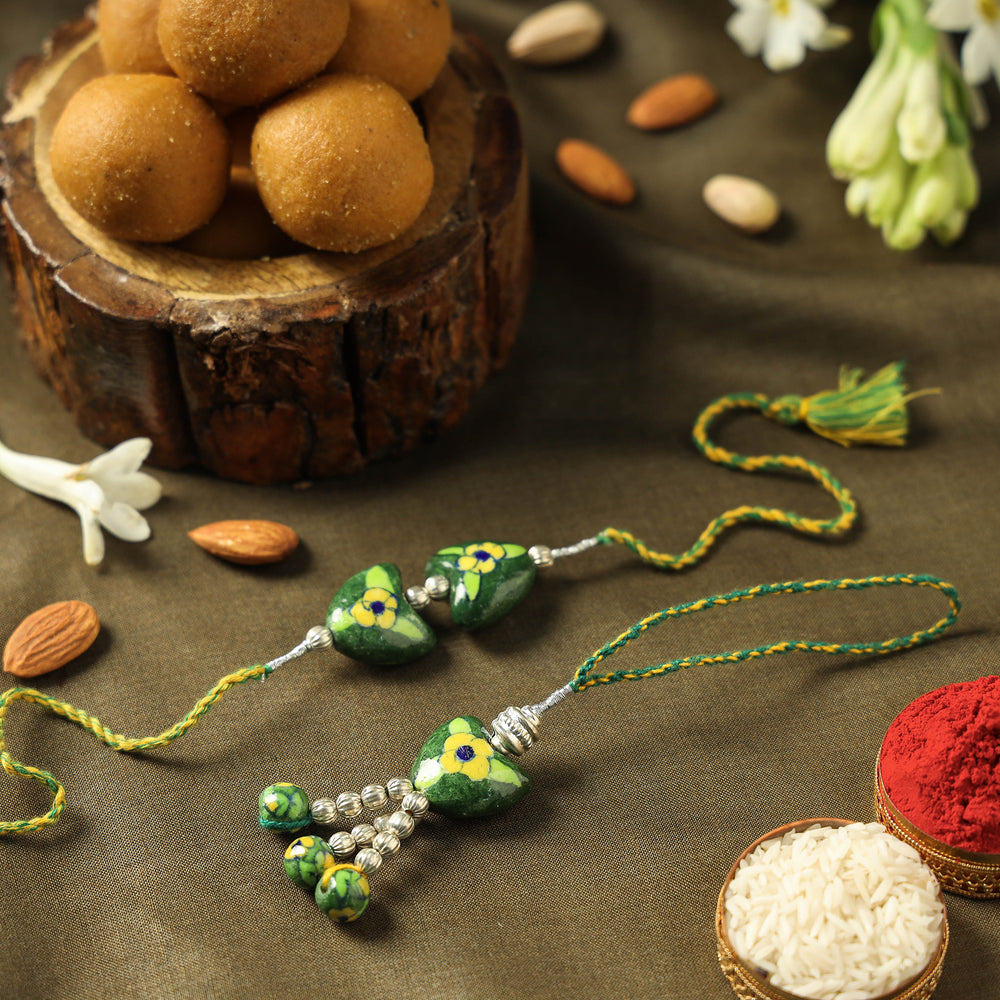 Patwa Blue Pottery Beads Bhaiya Bhabhi Rakhi with Besan Laddu