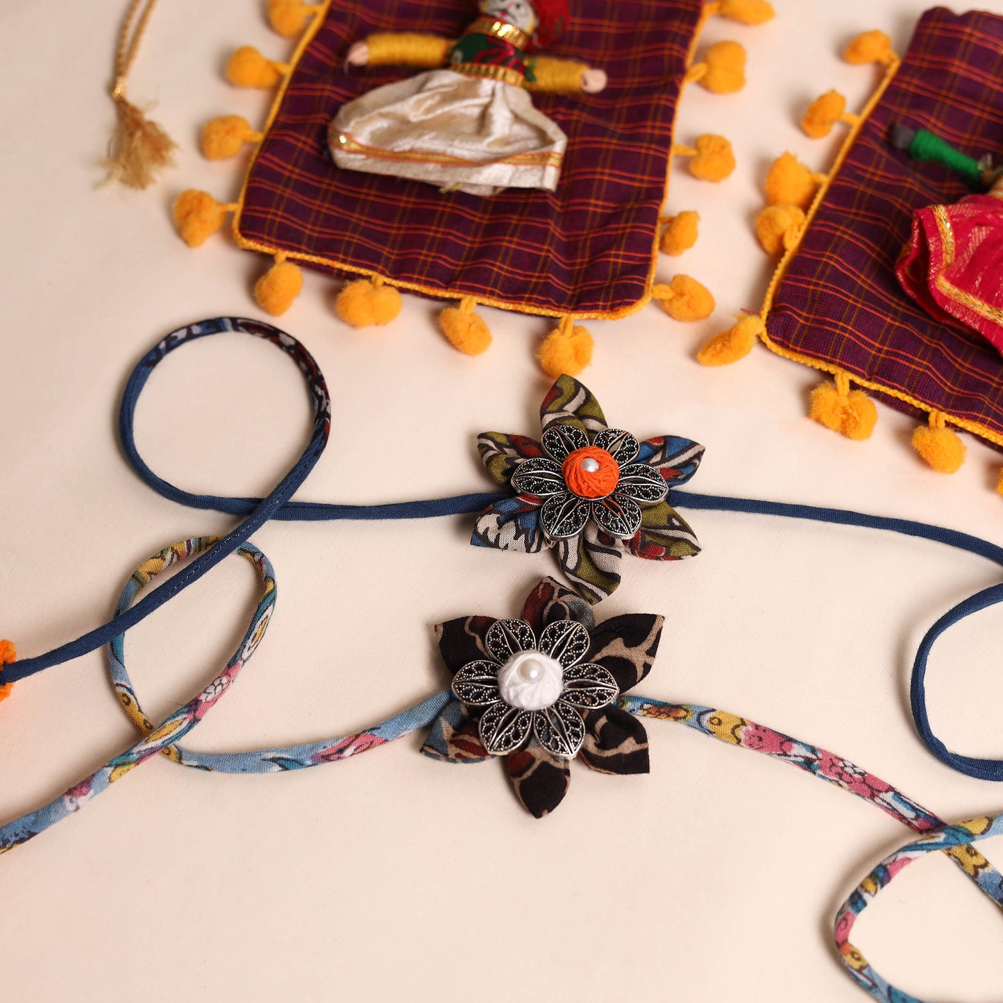  Handmade GS Fabric Flower Rakhi (Set of 2)