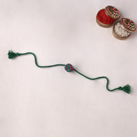 Round - reusable handmade threadwork kids rakhi with potli