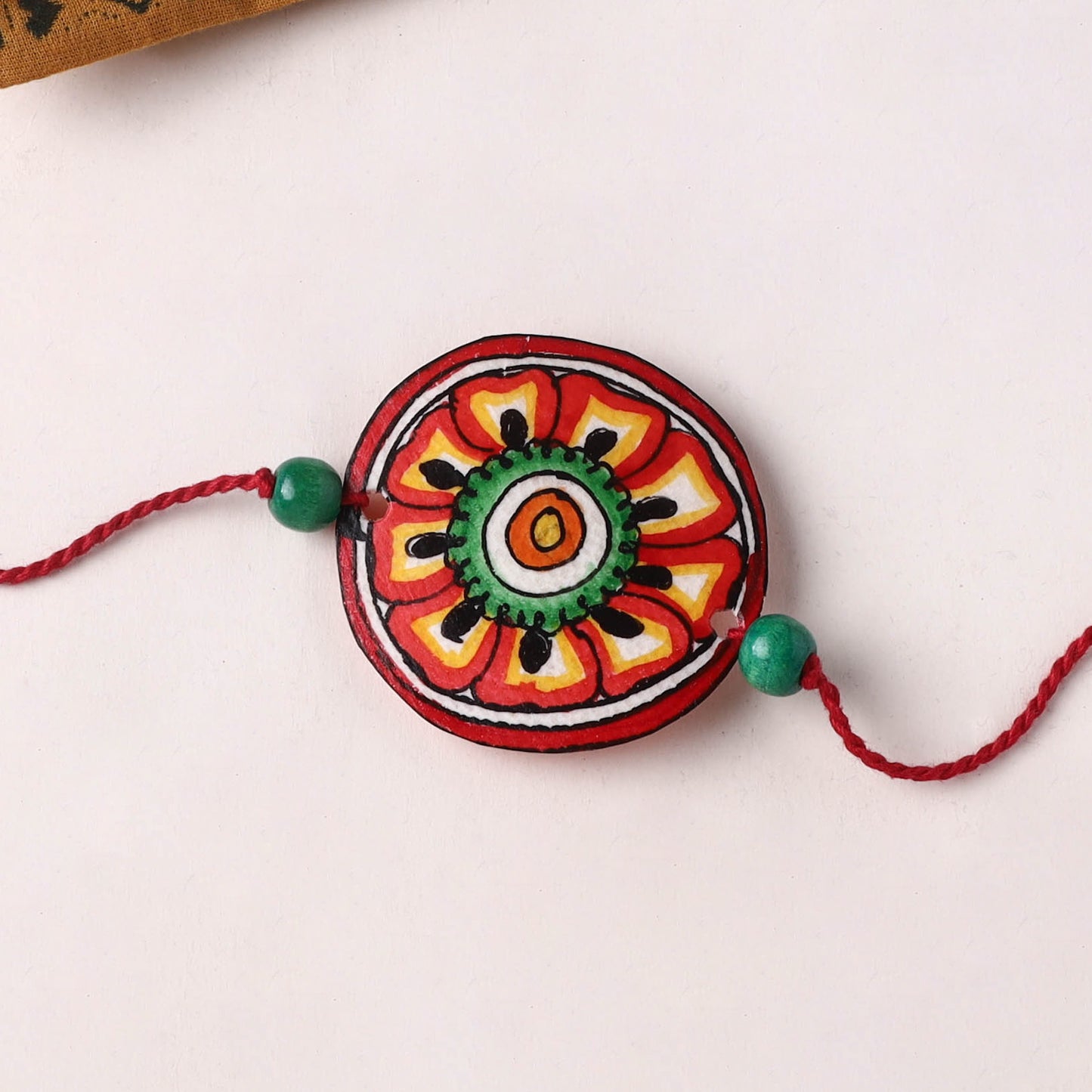 Flower - Handpainted Tholu Bommalata Leather Rakhi (Assorted) 01