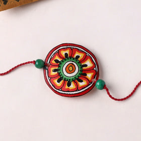 Flower - Handpainted Tholu Bommalata Leather Rakhi (Assorted) 01