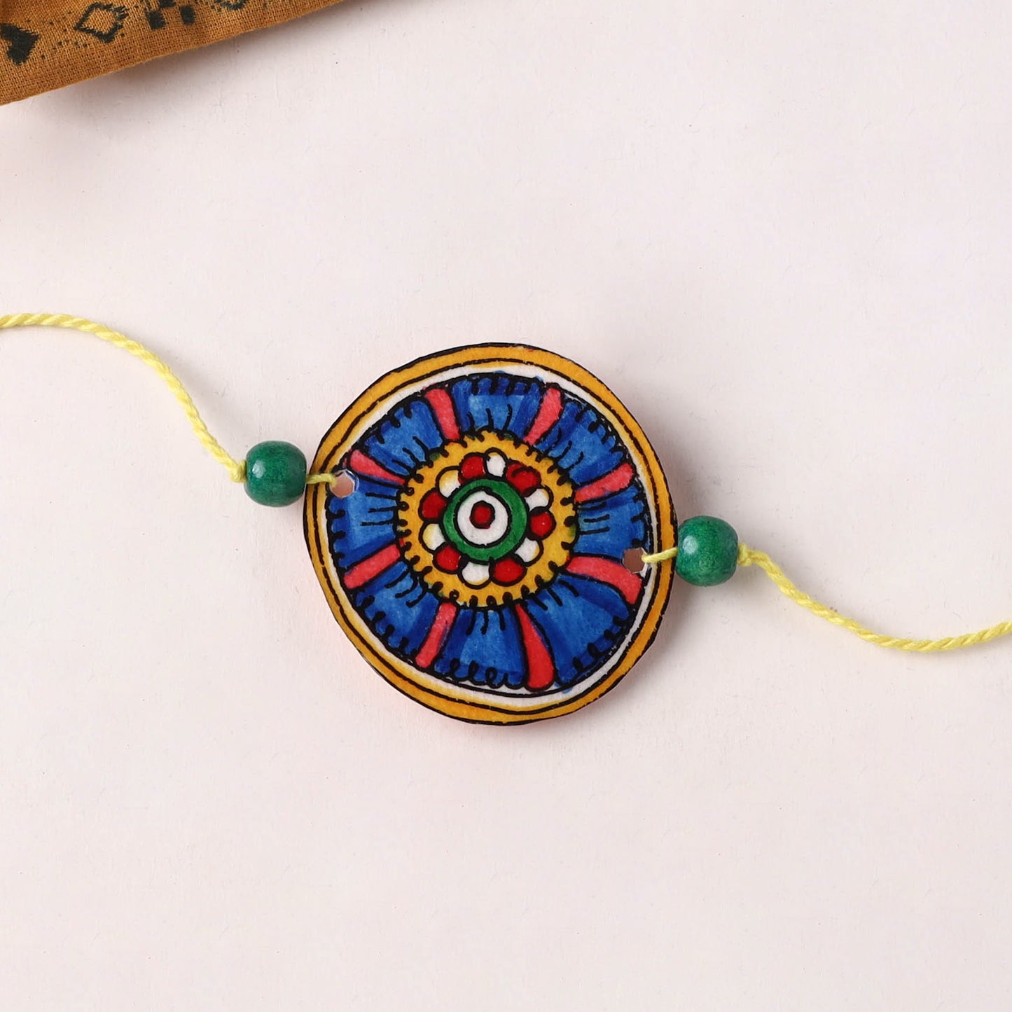 Handpainted Tholu Bommalata Leather Rakhi (Assorted) 03