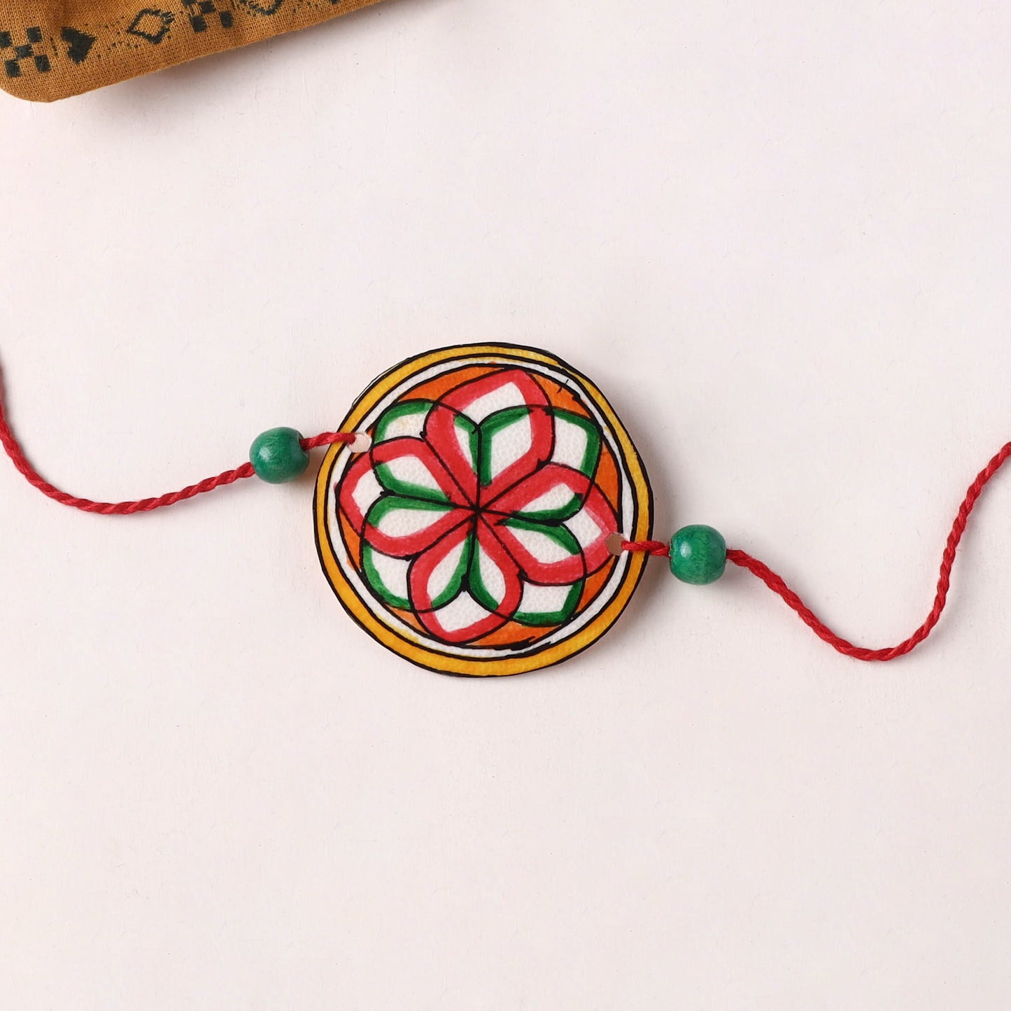 Handpainted Tholu Bommalata Leather Rakhi (Assorted) 04