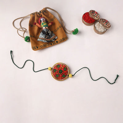 Flower - Handpainted Tholu Bommalata Leather Rakhi (Assorted) 05