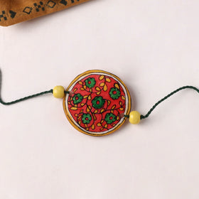 Flower - Handpainted Tholu Bommalata Leather Rakhi (Assorted) 05
