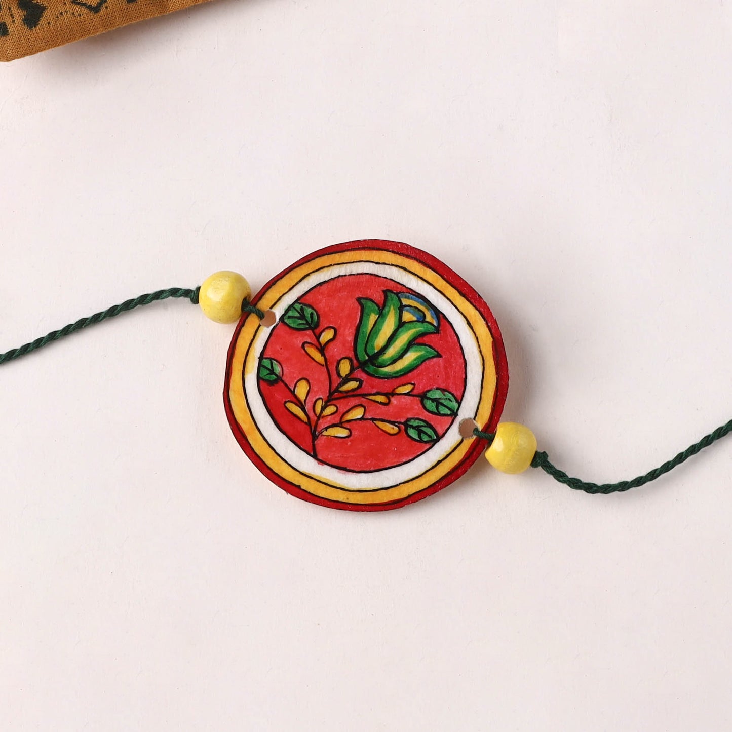Flower - Handpainted Tholu Bommalata Leather Rakhi (Assorted) 06