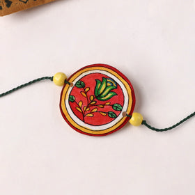Flower - Handpainted Tholu Bommalata Leather Rakhi (Assorted) 06