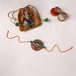 Reusable Handpainted Tholu Bommalata Leather Rakhi with Potli (Assorted) 08