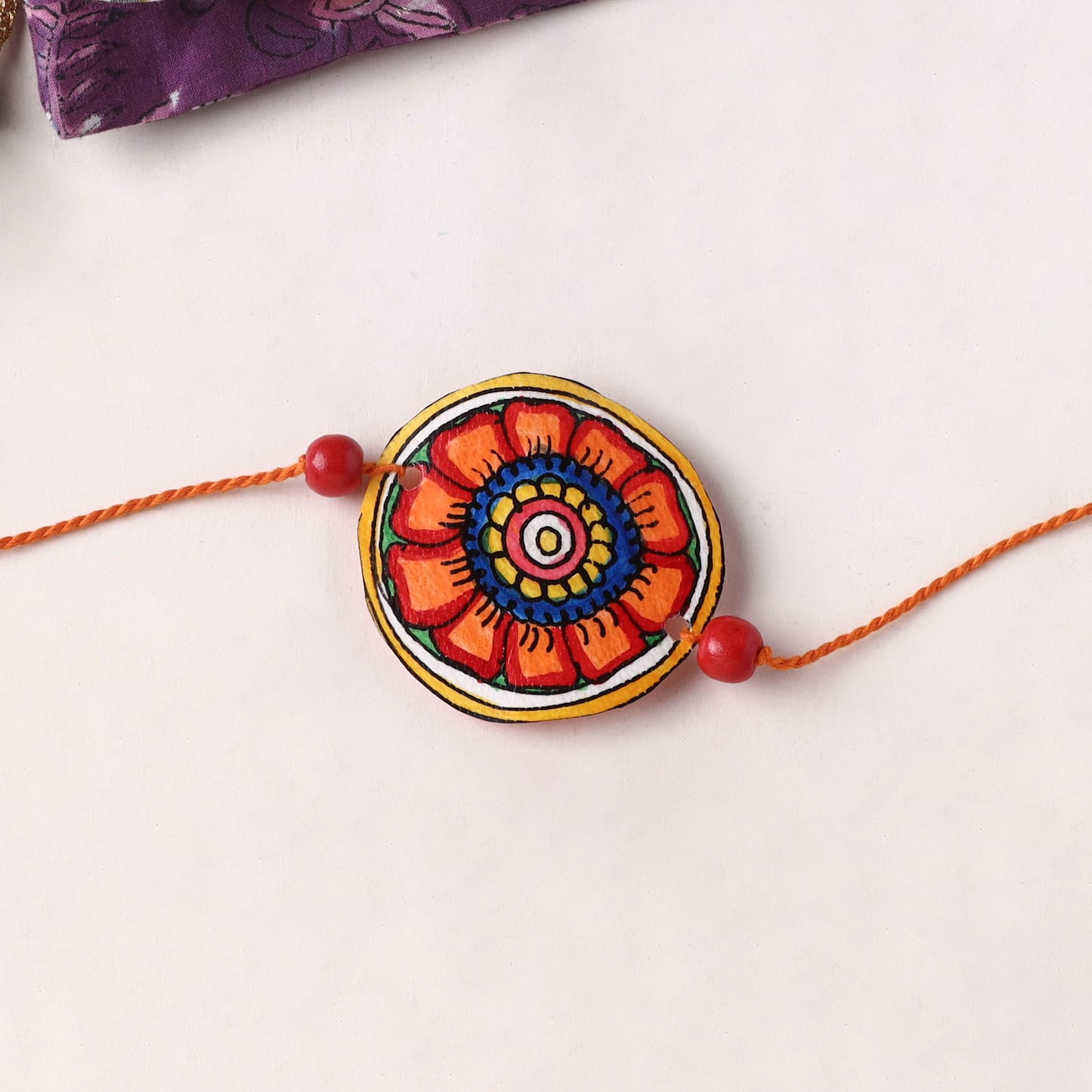 Flower - Handpainted Tholu Bommalata Leather Rakhi (Assorted) 09
