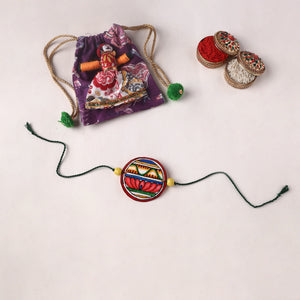 Flower - Reusable Handpainted Tholu Bommalata Leather Rakhi with Potli (Assorted) 11