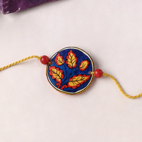 Leaf - Handpainted Tholu Bommalata Leather Rakhi (Assorted) 12
