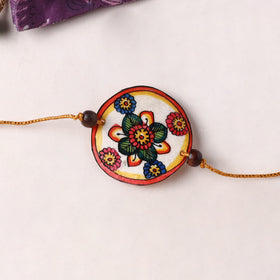 Handpainted Tholu Bommalata Leather Rakhi (Assorted) 13