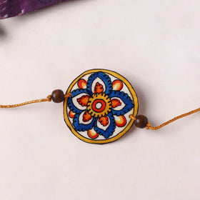 Handpainted Tholu Bommalata Leather Rakhi (Assorted) 25