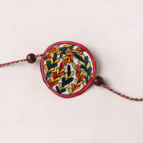 Handpainted Tholu Bommalata Leather Rakhi (Assorted) 26