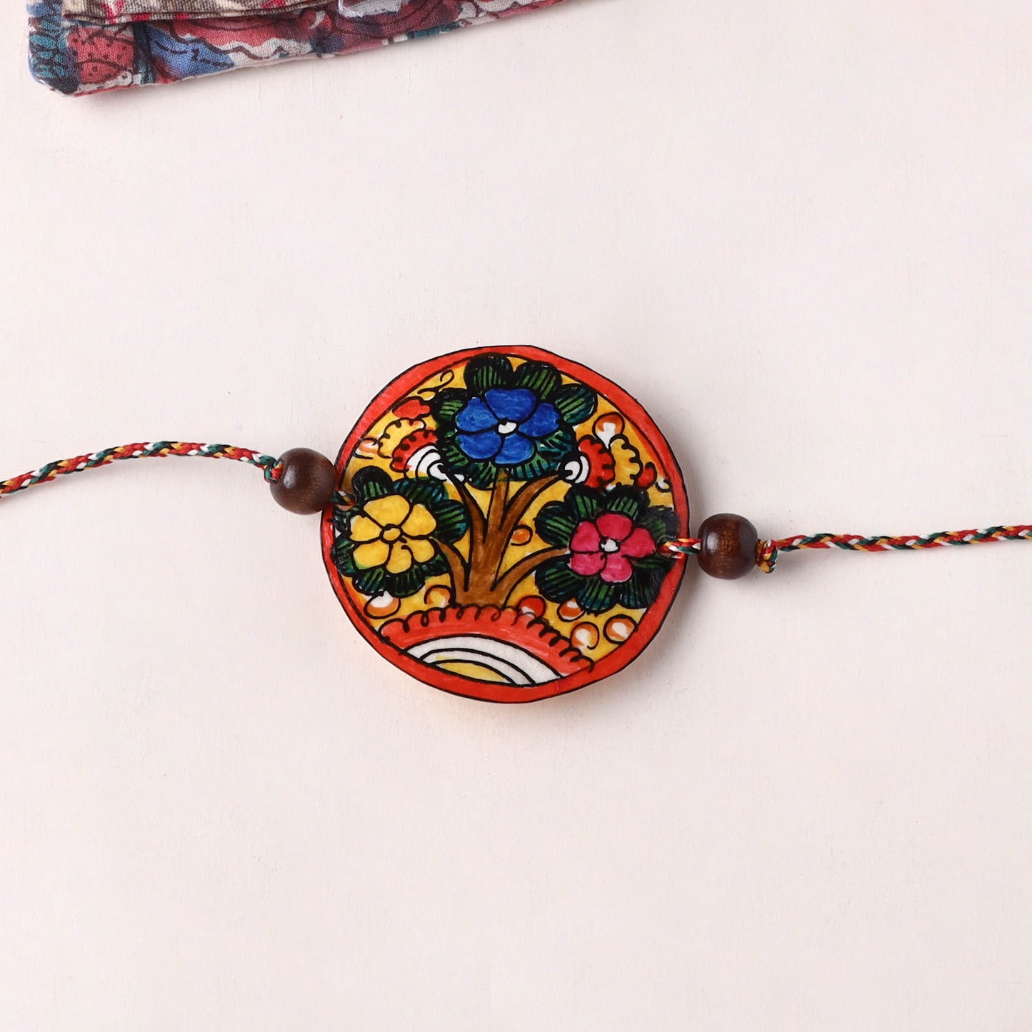 Flower - Handpainted Tholu Bommalata Leather Rakhi (Assorted) 30
