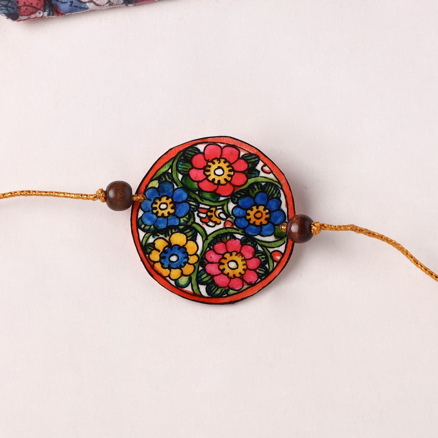 Flower - Handpainted Tholu Bommalata Leather Rakhi (Assorted) 33