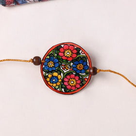 Flower - Handpainted Tholu Bommalata Leather Rakhi (Assorted) 33