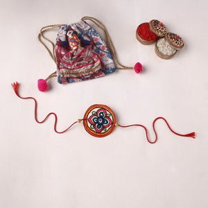 Flower - Reusable Handpainted Tholu Bommalata Leather Rakhi with Potli (Assorted) 34