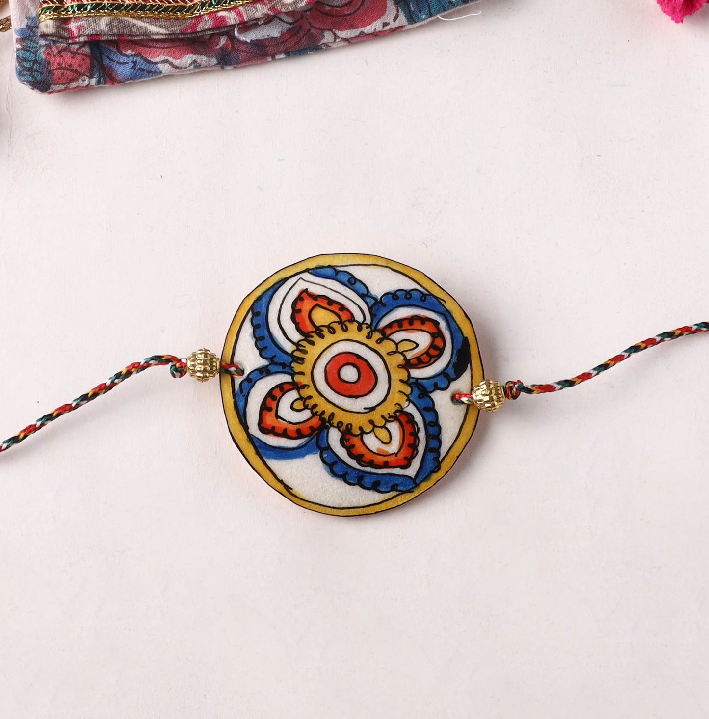 Flower - Handpainted Tholu Bommalata Leather Rakhi (Assorted) 40