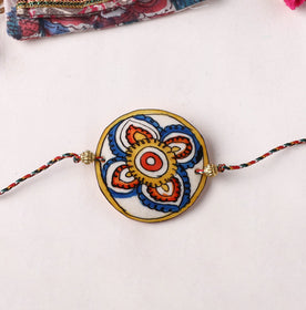 Flower - Handpainted Tholu Bommalata Leather Rakhi (Assorted) 40