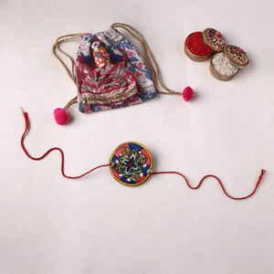 Flower - Reusable Handpainted Tholu Bommalata Leather Rakhi with Potli (Assorted) 29