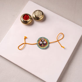 Lord Jagannath - Reusable Pattachitra Handpainted Rakhi with Potli 01