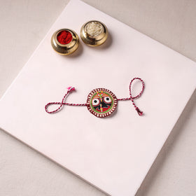 Lord Jagannath - Reusable Pattachitra Handpainted Rakhi with Potli 02