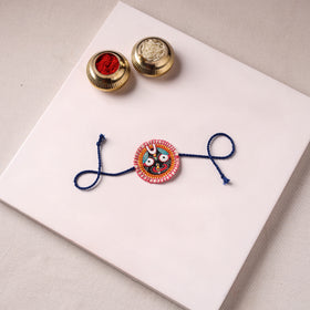 Lord Jagannath - Reusable Pattachitra Handpainted Rakhi with Potli 03