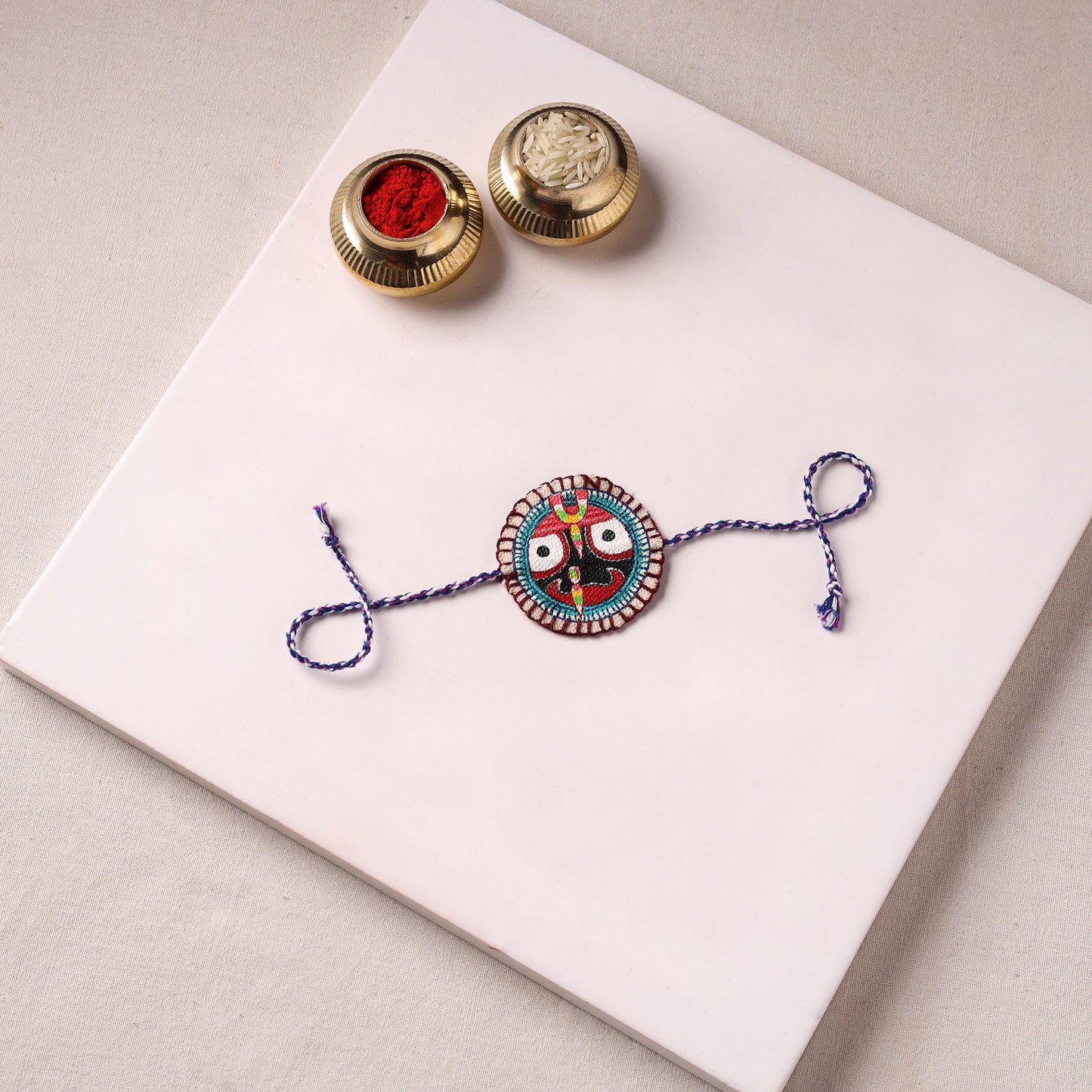 Lord Jagannath - Reusable Pattachitra Handpainted Rakhi with Potli 05